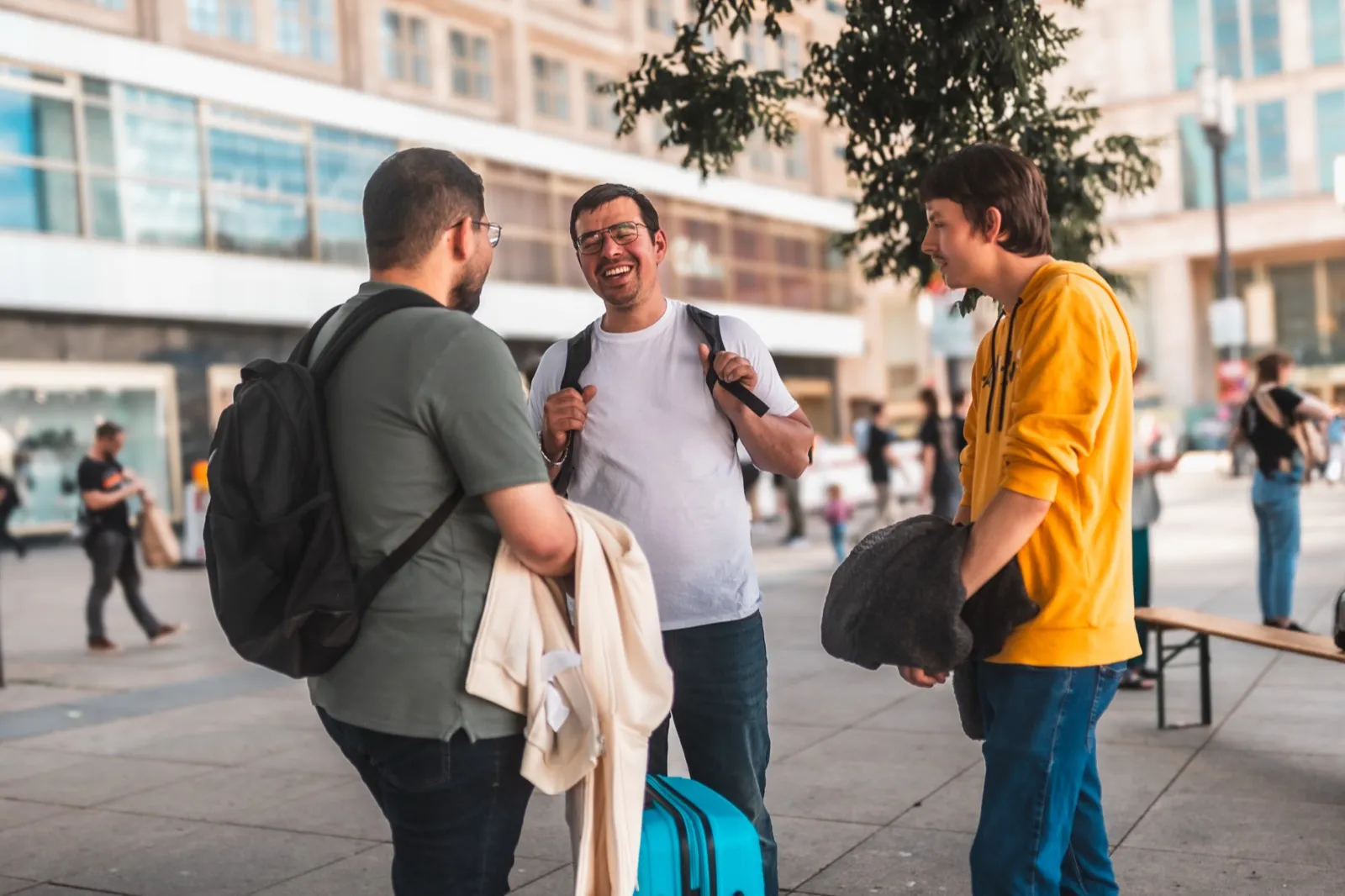Two people talking on a street