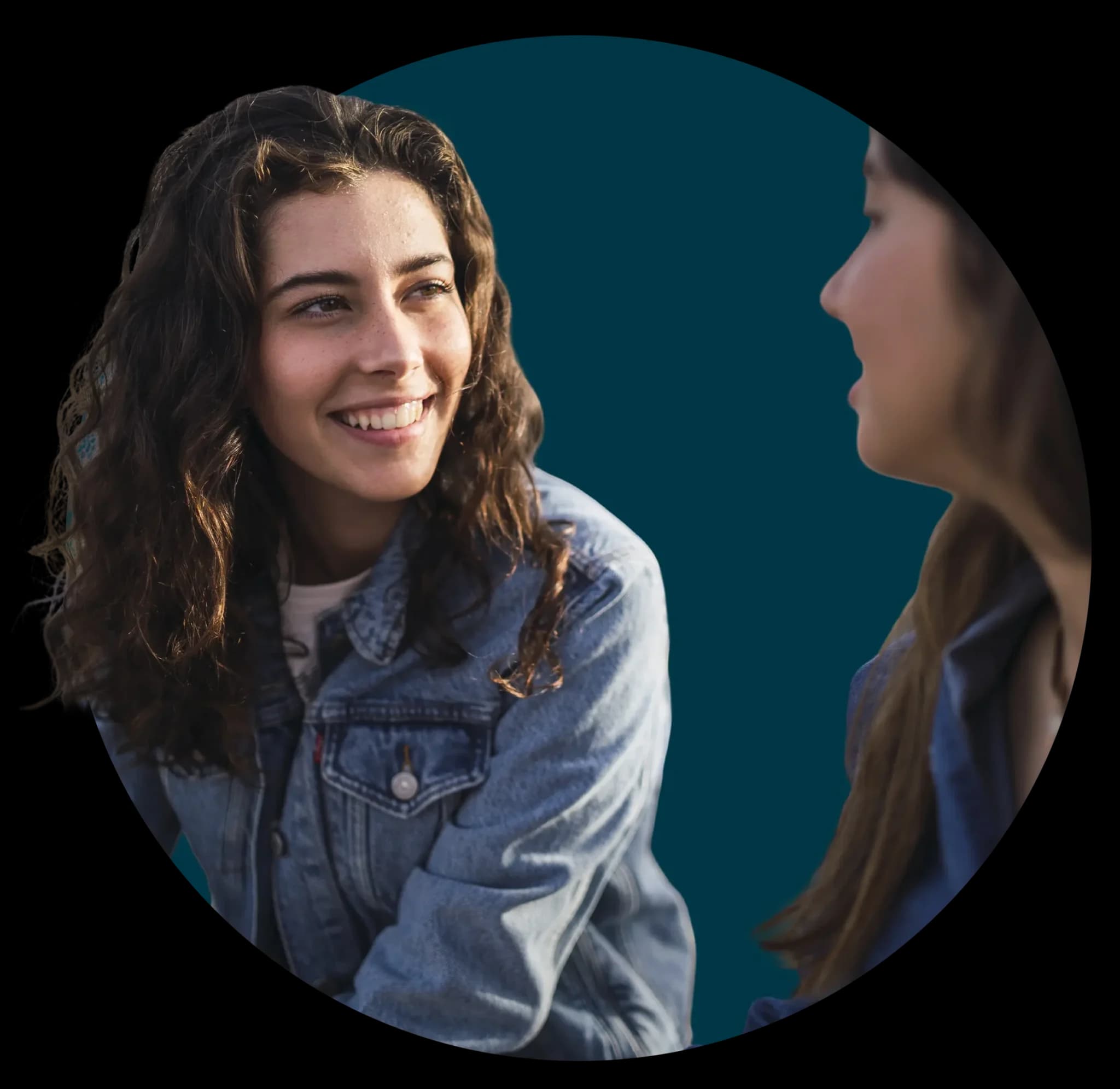 Two people in conversation on a street corner
